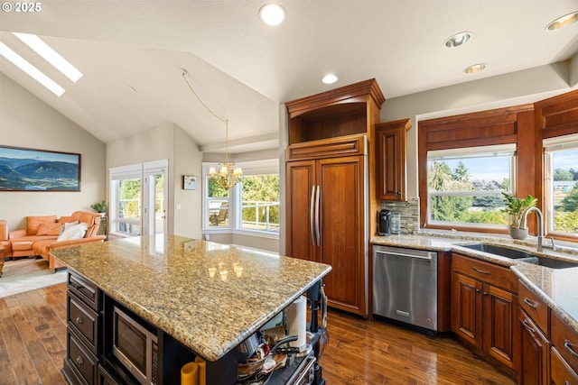2130 S 26th Ave, Ridgefield, WA 98642 - kitchen with open shelves, built in appliances, lofted ceiling, plenty of natural light, and dark wood finished floors