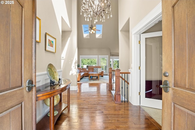 2130 S 26th Ave, Ridgefield, WA 98642 - foyer with a high ceiling, wood-type flooring, a chandelier, and a skylight