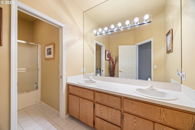 2130 S 26th Ave, Ridgefield, WA 98642 - full bath with double vanity, tile patterned flooring, and enclosed tub / shower combo