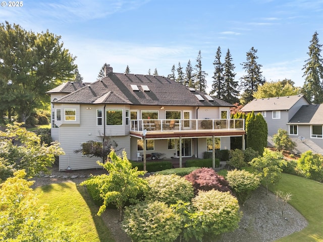 2130 S 26th Ave, Ridgefield, WA 98642 - back of house featuring a deck, a lawn, and a chimney