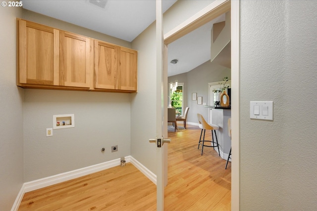 15564 S Neibur Rd, Oregon City, OR 97045 - laundry area with cabinet space, washer hookup, light wood-style floors, baseboards, and hookup for an electric dryer