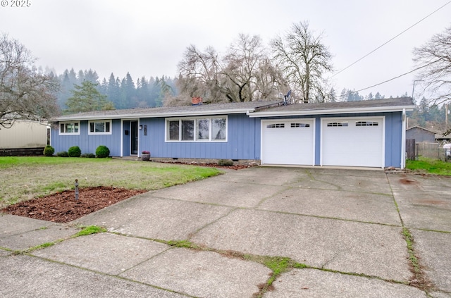 single story home featuring a garage and a front lawn