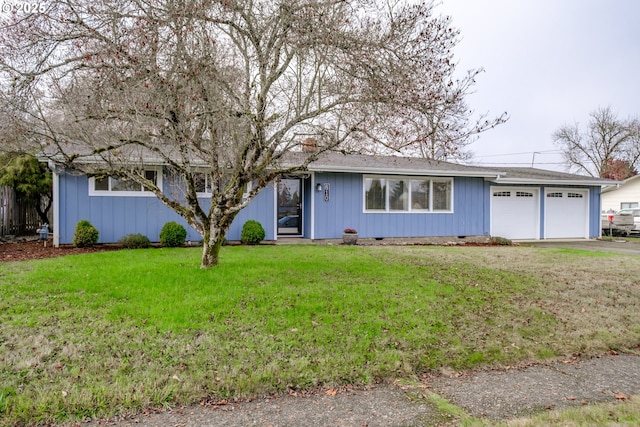 ranch-style home with a garage and a front yard