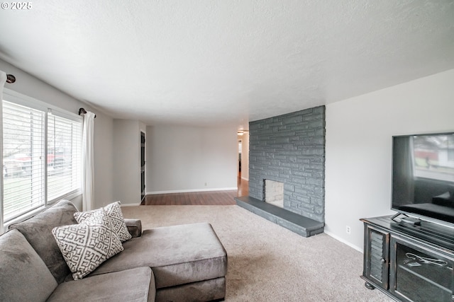 living room with a textured ceiling and light colored carpet