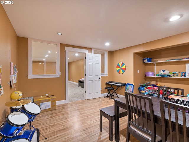 dining area with baseboards, recessed lighting, and wood finished floors