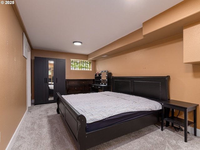 bedroom featuring baseboards, access to outside, and light carpet