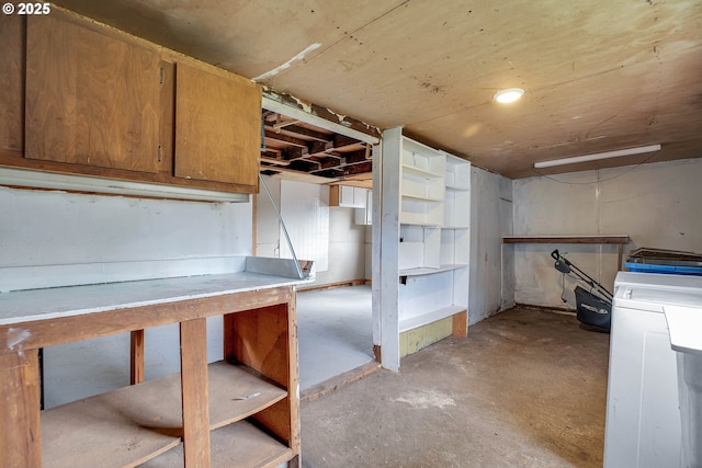 unfinished basement featuring washer / clothes dryer