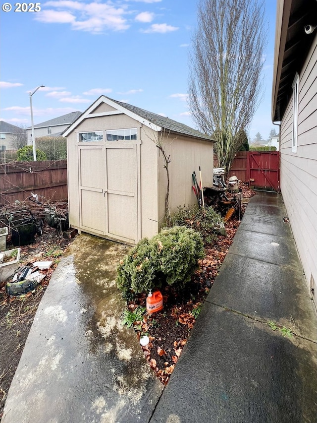 view of shed with fence