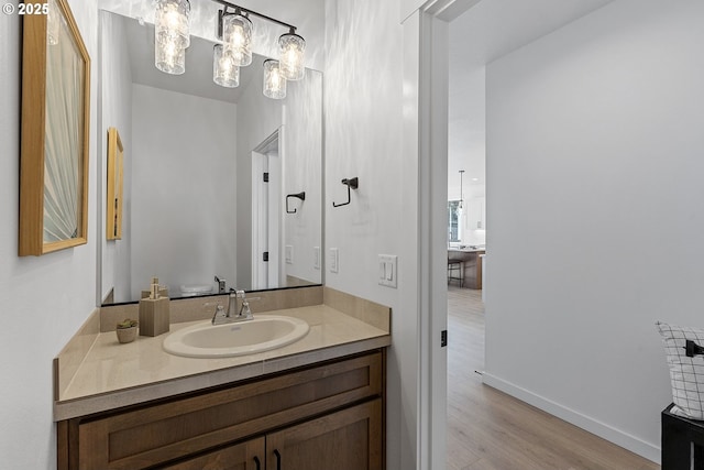 bathroom with vanity and wood-type flooring