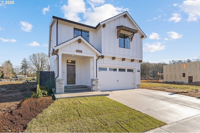 modern inspired farmhouse featuring a garage and a front lawn