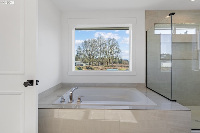 bathroom with tiled bath