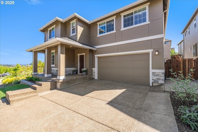 view of front of house with covered porch and a garage