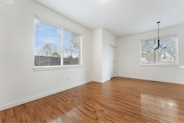 spare room featuring hardwood / wood-style floors