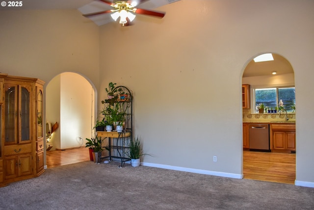 130 Candice Ct, Medford, OR 97504 - carpeted empty room featuring ceiling fan, sink, and a high ceiling