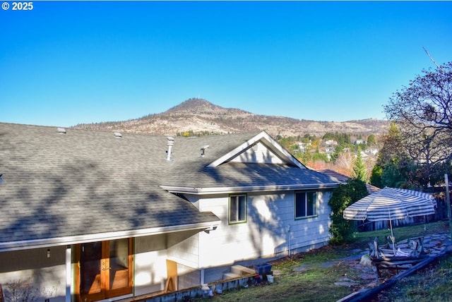 rear view of property with a mountain view