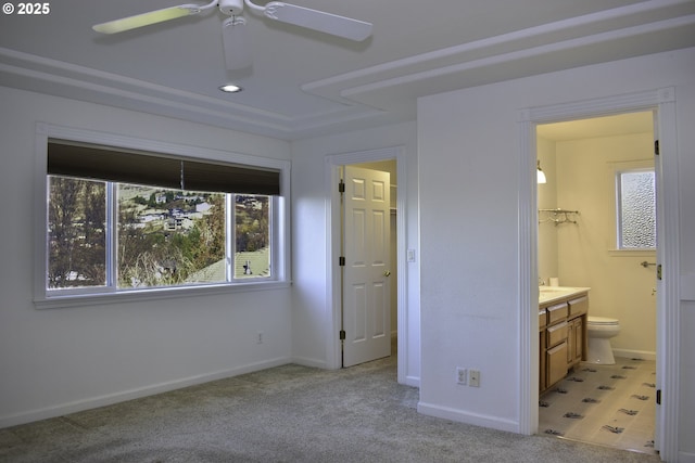 130 Candice Ct, Medford, OR 97504 - unfurnished bedroom featuring light carpet, connected bathroom, sink, and ceiling fan