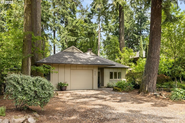 589 Ridgeway Rd, Lake Oswego, OR 97034 - view of front of home with driveway, roof with shingles, an attached garage, and a chimney