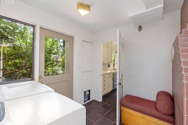 589 Ridgeway Rd, Lake Oswego, OR 97034 - laundry room with washing machine and clothes dryer and dark tile patterned flooring