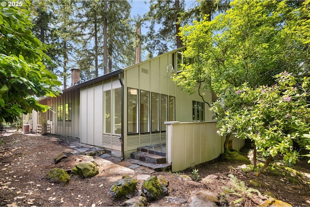 589 Ridgeway Rd, Lake Oswego, OR 97034 - view of side of property featuring board and batten siding and a chimney