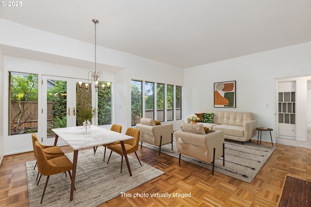 589 Ridgeway Rd, Lake Oswego, OR 97034 - dining space with plenty of natural light, a chandelier, and french doors