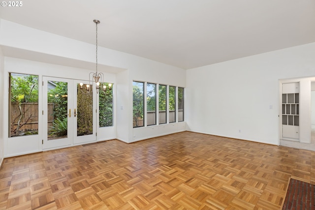 589 Ridgeway Rd, Lake Oswego, OR 97034 - empty room featuring a chandelier and plenty of natural light