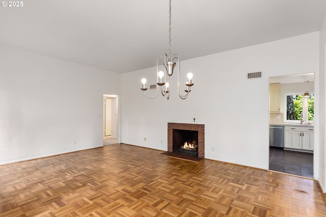 589 Ridgeway Rd, Lake Oswego, OR 97034 - unfurnished living room featuring a chandelier and a fireplace