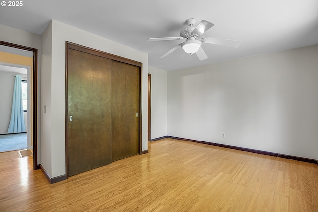 5786 SW 204th Pl, Beaverton, OR 97078 - unfurnished bedroom featuring light wood finished floors, a closet, baseboards, and ceiling fan