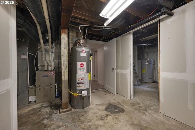 unfinished below grade area with strapped water heater and gas water heater