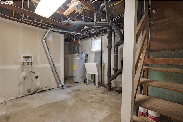 basement featuring water heater and a sink