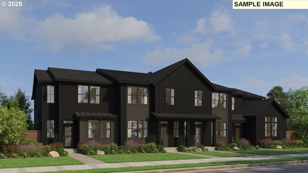 townhome / multi-family property featuring board and batten siding, a standing seam roof, and metal roof