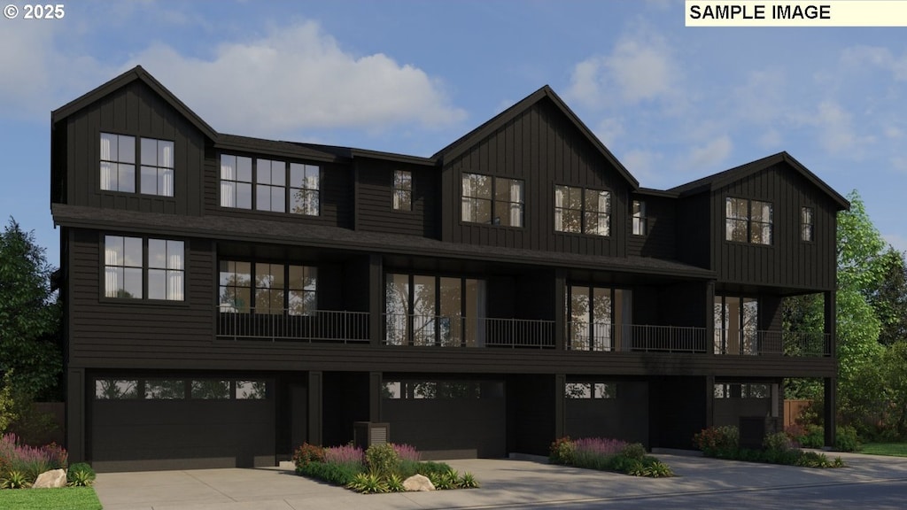 view of front of house with board and batten siding, a garage, and concrete driveway