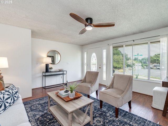 575 SE Centurion Ave, Gresham, OR 97080 - living room featuring a textured ceiling, ceiling fan, and wood finished floors