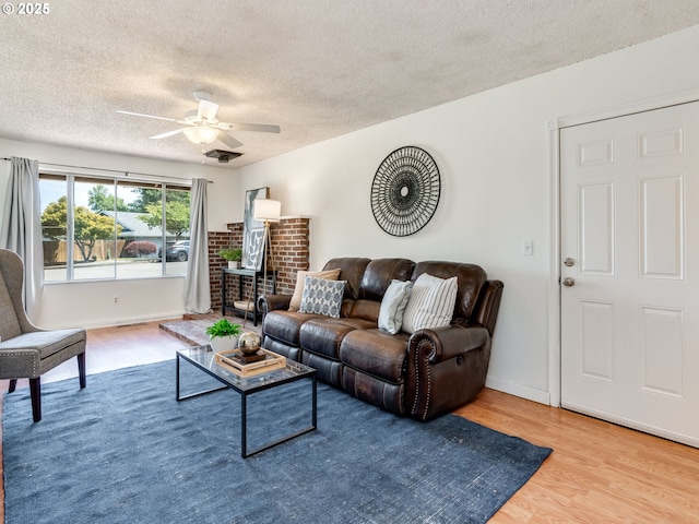 575 SE Centurion Ave, Gresham, OR 97080 - living room featuring a textured ceiling, wood finished floors, and a ceiling fan