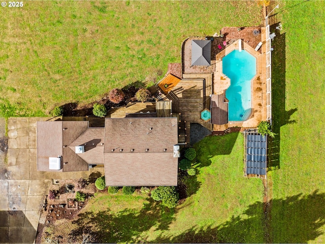 aerial view of property and surrounding area featuring a pool area