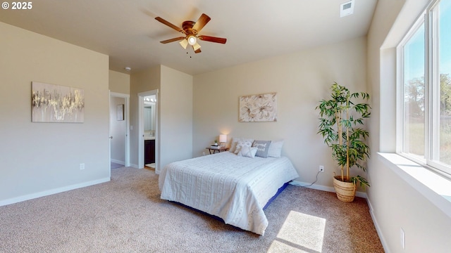 917 SE 9th Dr, Hermiston, OR 97838 - carpeted bedroom with multiple windows, baseboards, and a ceiling fan