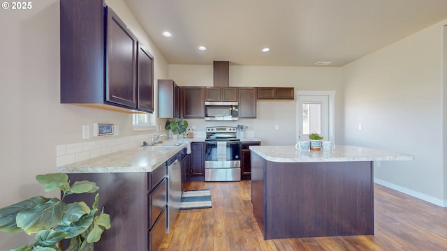 917 SE 9th Dr, Hermiston, OR 97838 - kitchen featuring stainless steel appliances, light countertops, dark wood finished floors, a center island, and recessed lighting