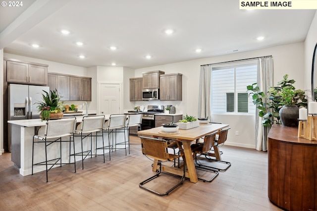 dining space featuring light hardwood / wood-style floors