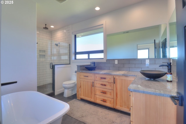 95660 Spirit Ridge Rd, Gold Beach, OR 97444 - full bathroom with a shower stall, healthy amount of natural light, a freestanding tub, double vanity, and recessed lighting