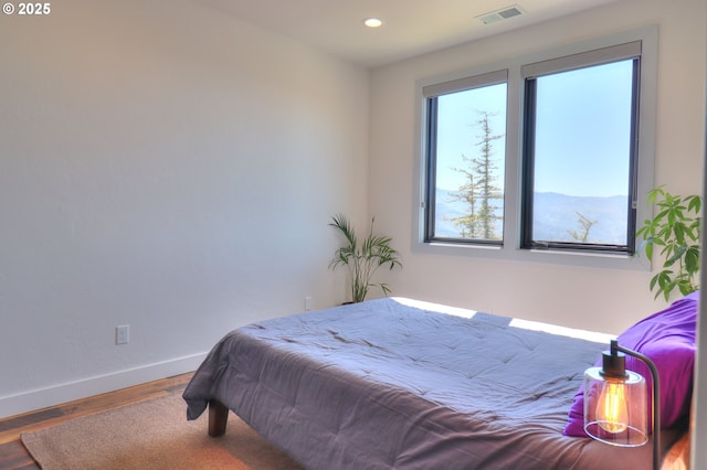 95660 Spirit Ridge Rd, Gold Beach, OR 97444 - bedroom with baseboards, wood finished floors, and recessed lighting