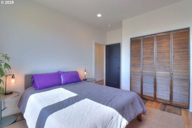 95660 Spirit Ridge Rd, Gold Beach, OR 97444 - bedroom with a closet, recessed lighting, wood finished floors, and baseboards
