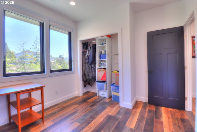 95660 Spirit Ridge Rd, Gold Beach, OR 97444 - bedroom featuring dark wood-type flooring, baseboards, recessed lighting, and a closet