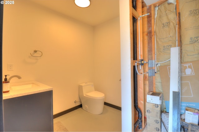 95660 Spirit Ridge Rd, Gold Beach, OR 97444 - bathroom featuring toilet, baseboards, and vanity