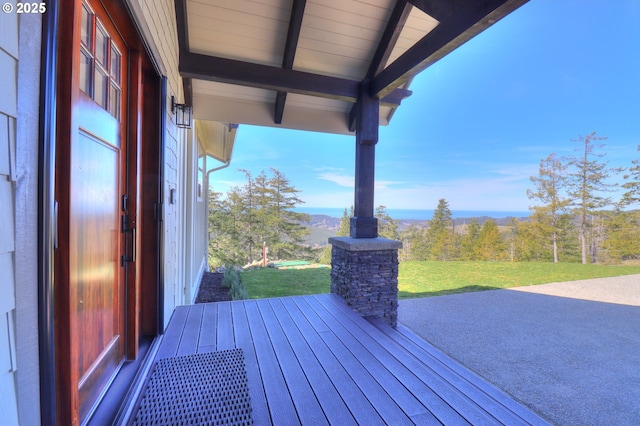 95660 Spirit Ridge Rd, Gold Beach, OR 97444 - wooden deck with a lawn and a patio area