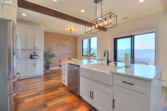 95660 Spirit Ridge Rd, Gold Beach, OR 97444 - kitchen with stainless steel appliances, a sink, wooden walls, white cabinets, and recessed lighting