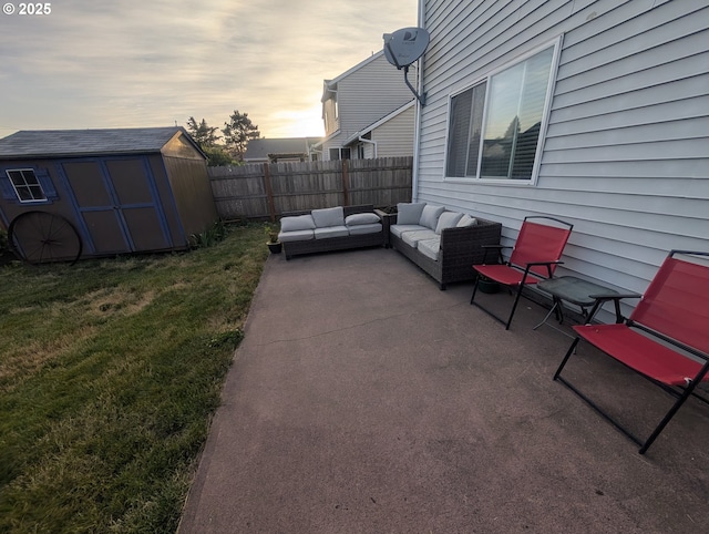 33874 NE Erin Dr, Scappoose, OR 97056 - fenced backyard featuring an outdoor hangout area, a patio area, and a storage shed