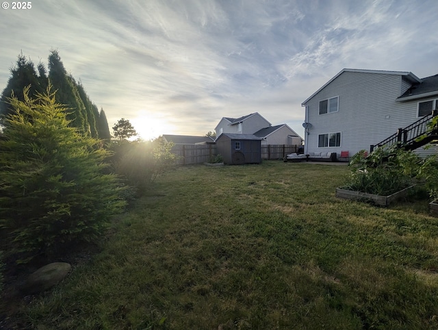 33874 NE Erin Dr, Scappoose, OR 97056 - fenced backyard with a storage shed and a vegetable garden