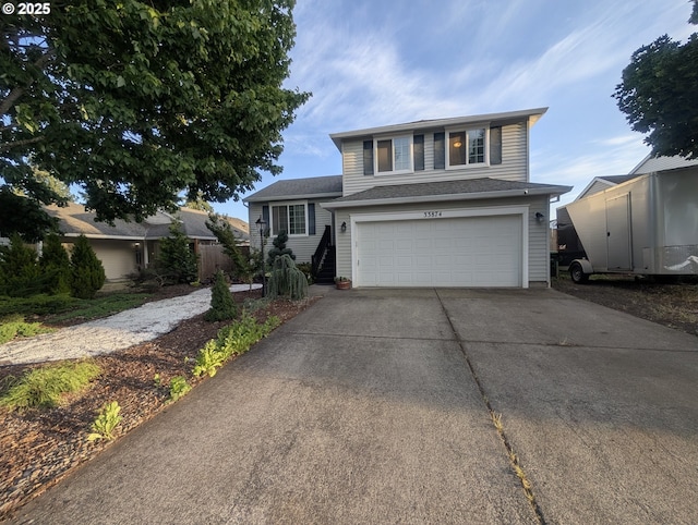 33874 NE Erin Dr, Scappoose, OR 97056 - view of front facade featuring concrete driveway and a garage