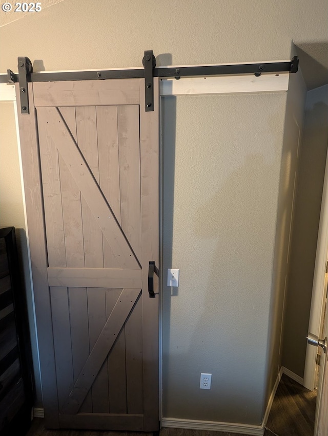 33874 NE Erin Dr, Scappoose, OR 97056 - detailed view of a barn door and wood finished floors