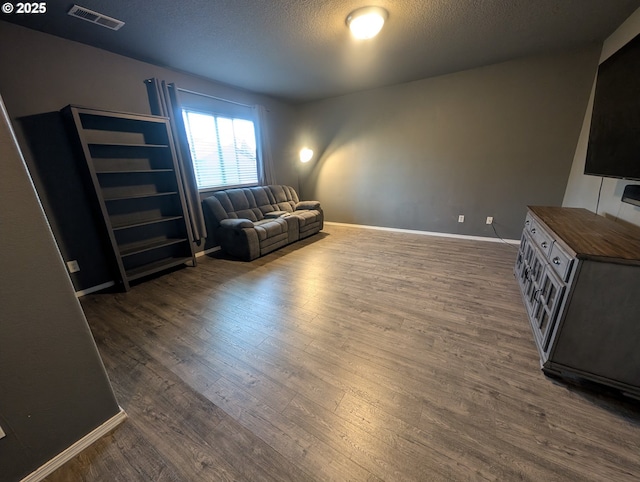 33874 NE Erin Dr, Scappoose, OR 97056 - sitting room featuring dark wood-style flooring and a textured ceiling