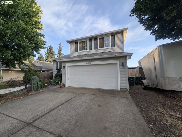 33874 NE Erin Dr, Scappoose, OR 97056 - traditional-style house with concrete driveway and an attached garage